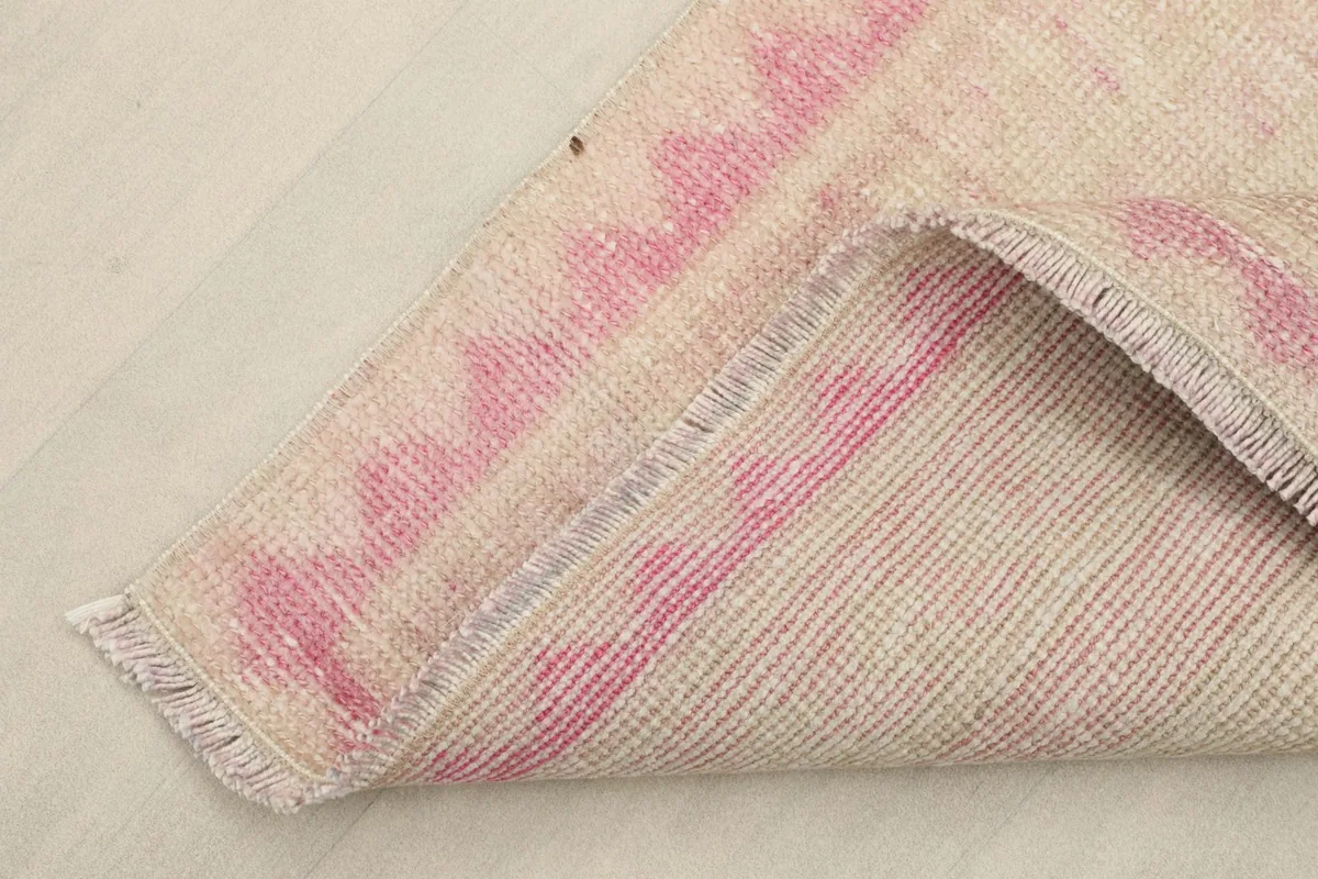 Underside view of the hand-knotted wool pile on cotton foundation