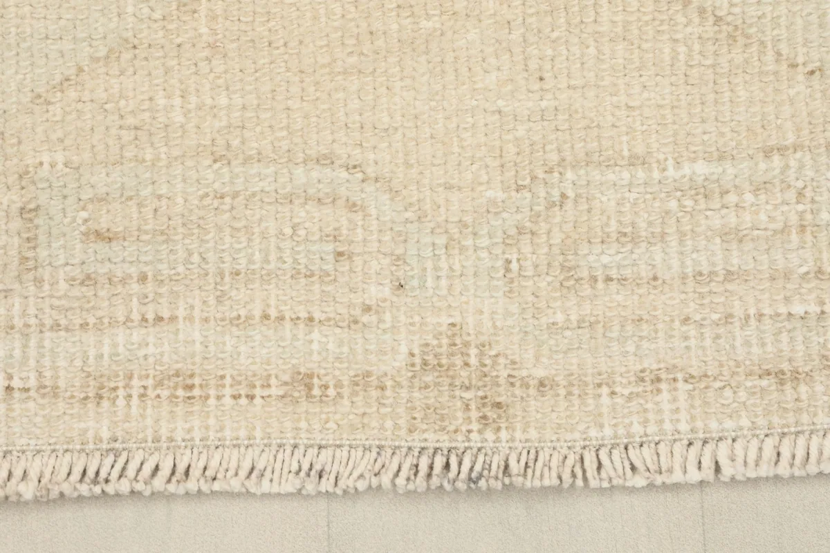 Close-up of the hand-knotted fringe and edge of the vintage runner