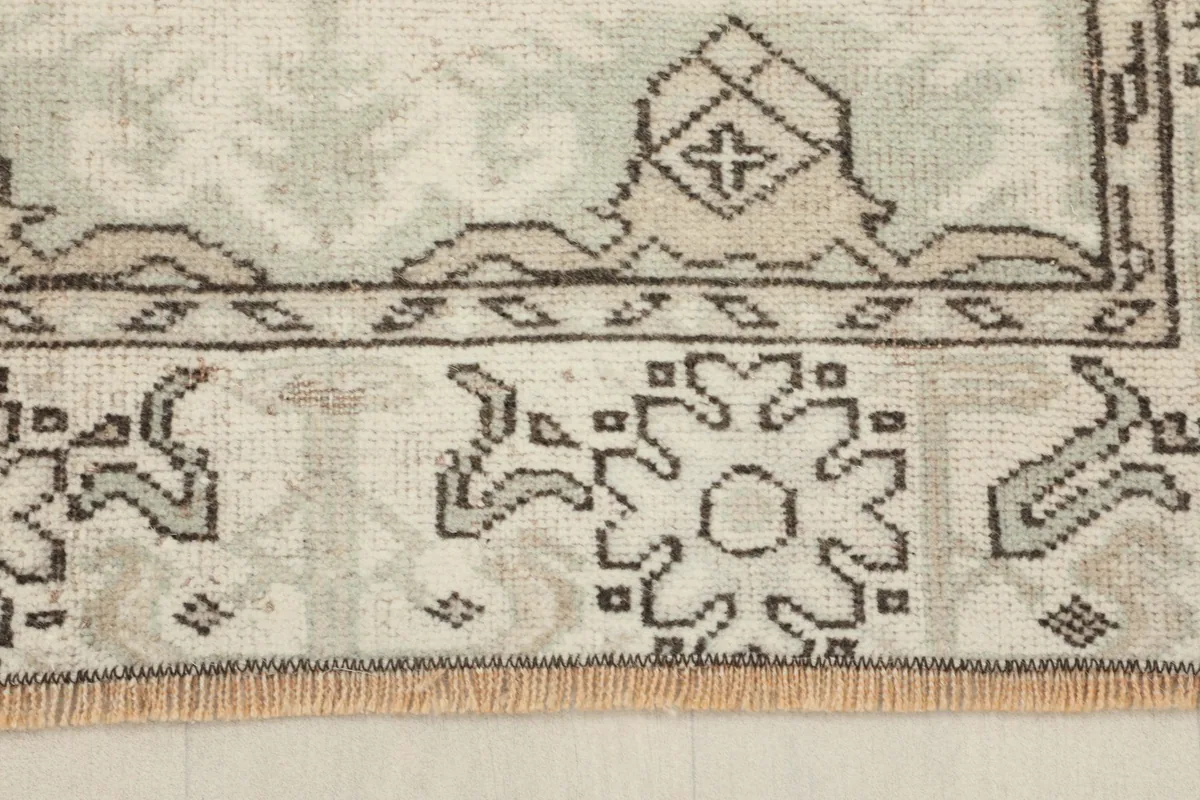 Close-up of the border design and fringe, showing the hand-knotted texture