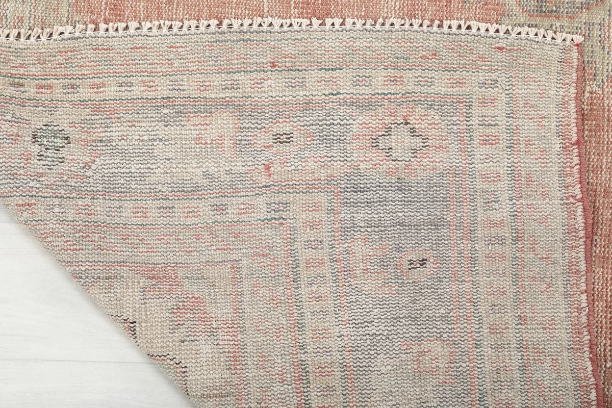 View of the rug's back, revealing the hand-knotted construction and foundation