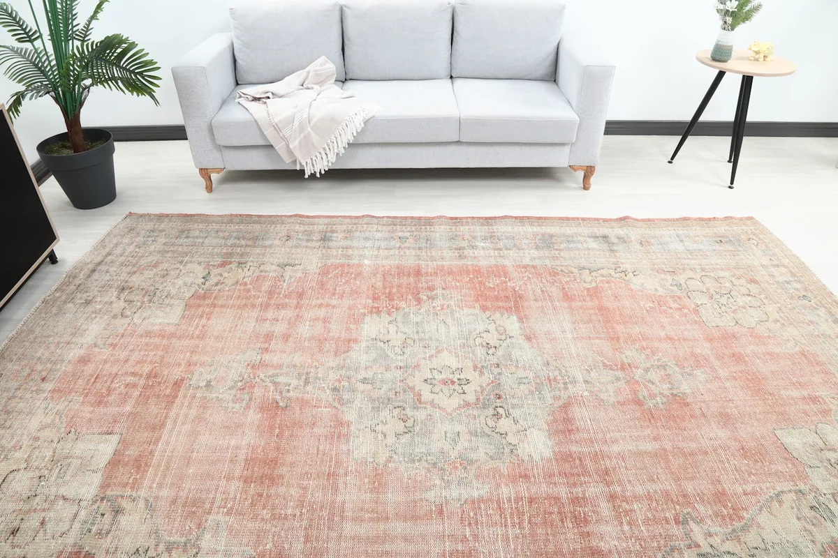 Overhead perspective of the rug in a room, emphasizing the central medallion and overall pattern