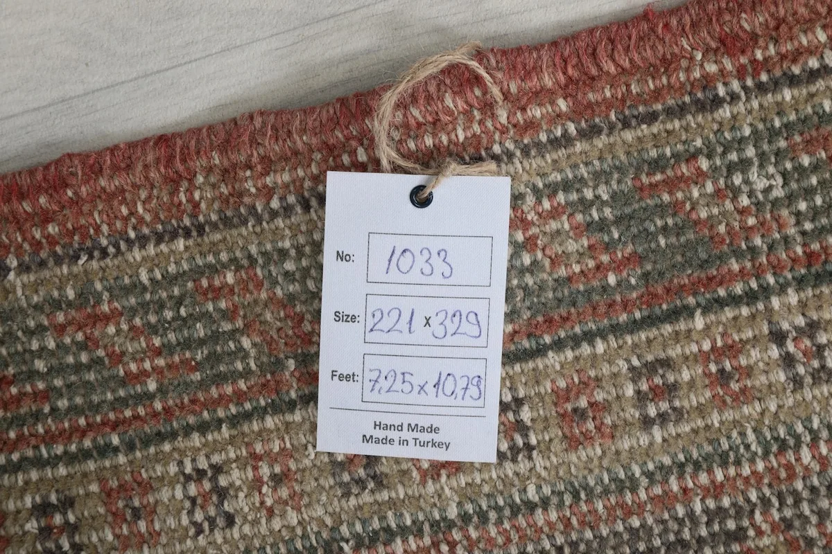 Close-up of the rug's back with a product tag showing dimensions and origin information