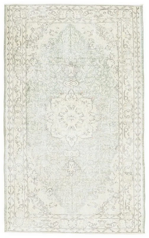 Full overhead view of the 5x8 vintage Anatolian rug with a soft green field and cream medallion.