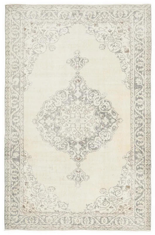 Full top view of the ivory and gray vintage Anatolian rug with a central medallion.