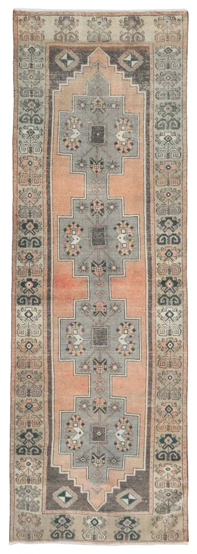 Full top view of the 4'0" x 12'9" orange and gray geometric Anatolian runner rug on a white background.