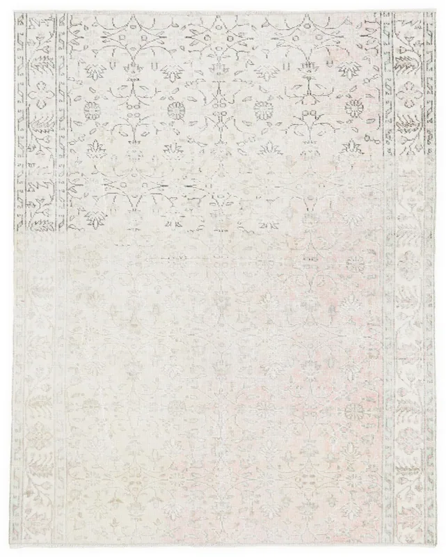Full top view of the rose and ivory floral vintage Anatolian rug on a white background