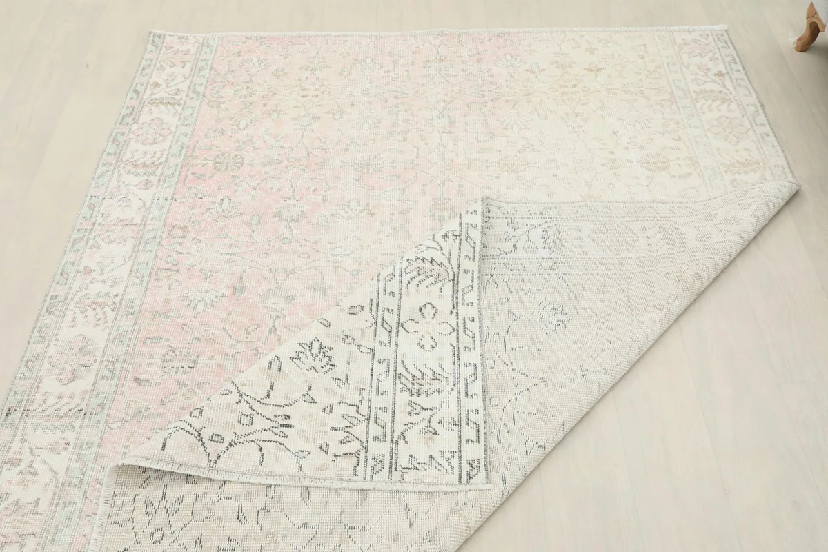 Another perspective of the rug folded, showing the reverse side and the construction
