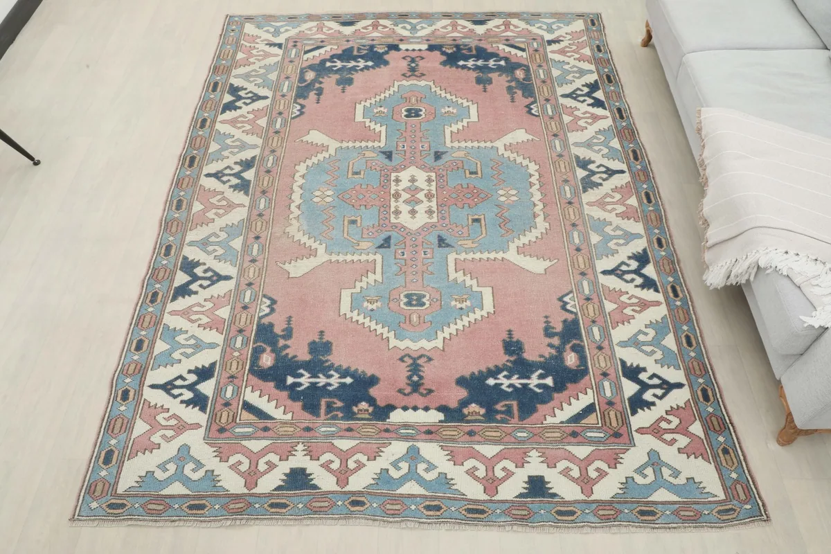 Full room view of the rose and navy vintage rug complementing the home decor