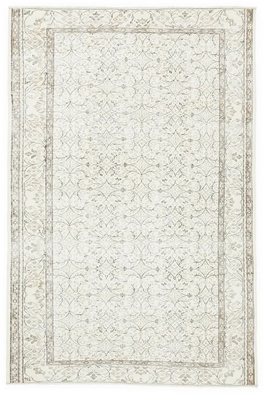 Full overhead view of the 5'10" x 8'11" vintage Anatolian area rug with ivory field and brown geometric patterns