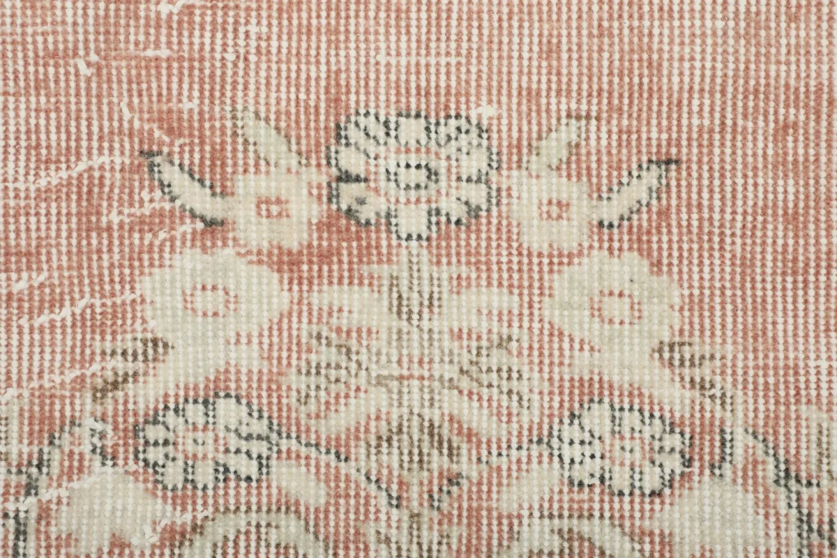 Close-up of the low wool pile and visible hand-knotted texture of the rug