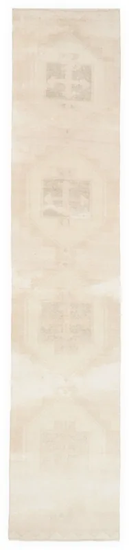 Full overhead view of the 3x15 ivory and beige vintage runner rug on a white background.