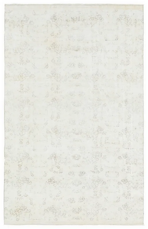 Full overhead view of the ivory faded floral area rug on a white background
