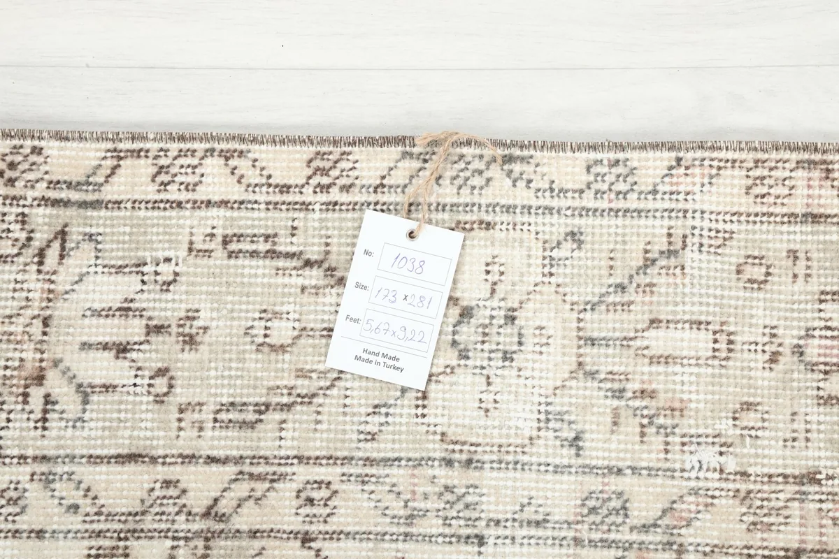 Tag attached to the rug's edge, showing product information and origin