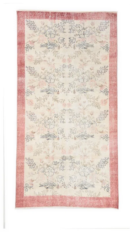 Full overhead view of the 3'5" x 6'8" ivory and rose vintage Anatolian rug on a white background