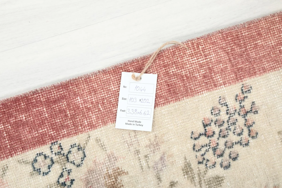 Product tag on the corner of the rug, showing origin and material details
