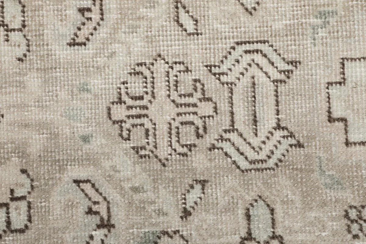 Detailed view of specific tribal motifs and subtle color variations in the rug's pile.