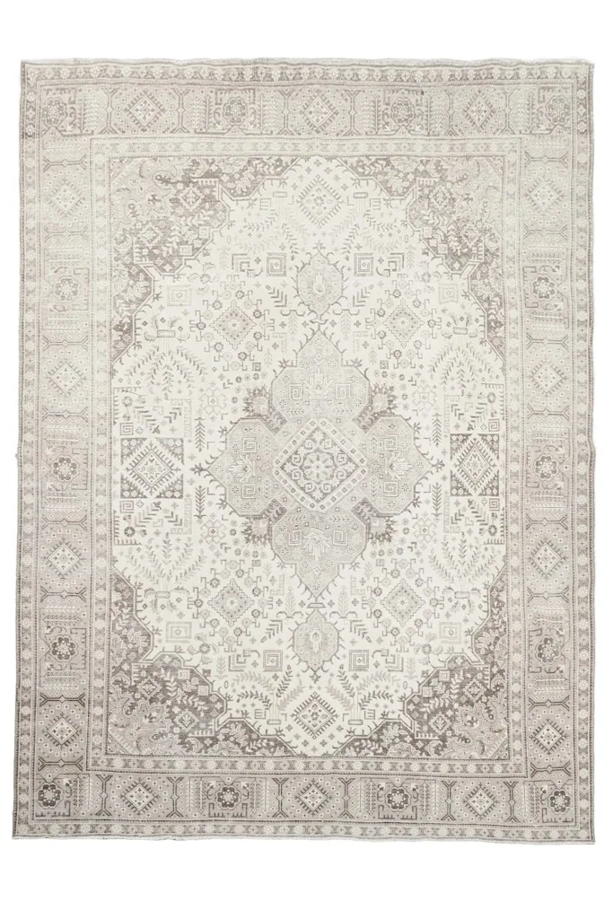 Overhead view showcasing the intricate medallion and geometric patterns of the Persian rug