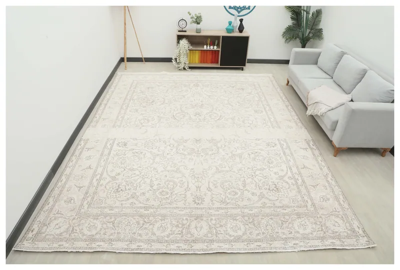 Full overhead view of the 10x12 cream and gray vintage Persian rug on a white background