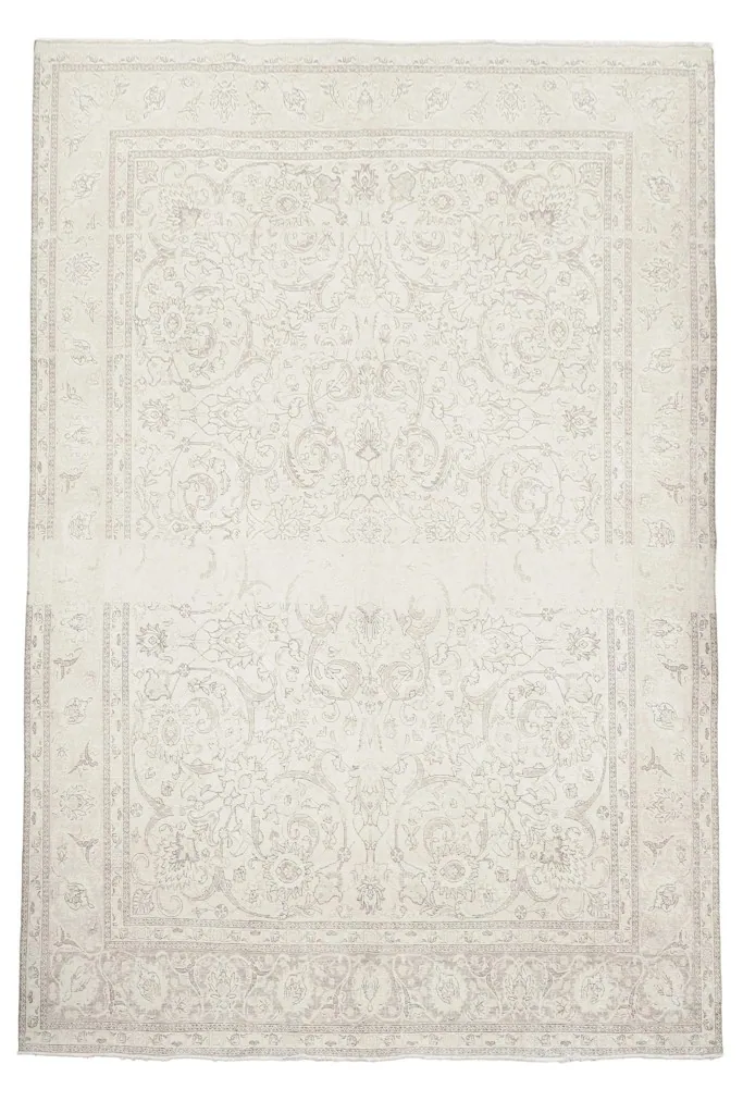 Full overhead shot of the cream Persian rug, highlighting its intricate floral pattern