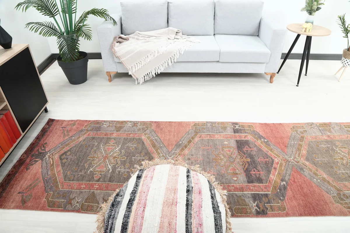 Overhead view of the rug in a living room, showcasing the full pattern and arrangement.