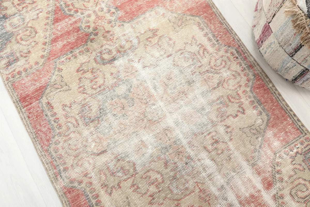 Detailed view of the rug's central medallion and surrounding patterns