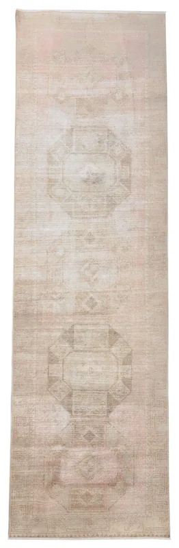 Full top view of the 3'8" x 12'8" vintage Anatolian runner rug with beige and rose tones