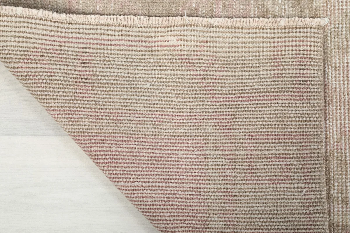 Back of the hand-knotted wool runner rug, showing the cotton foundation and knotting
