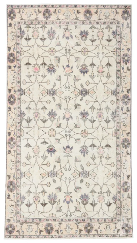 Full overhead view of the 3'6" x 6'8" ivory floral vintage Anatolian rug on a white background.