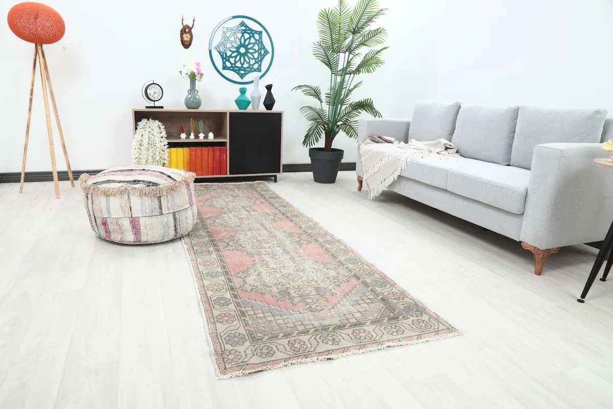 Angle view of the rose and beige runner rug in a contemporary living space