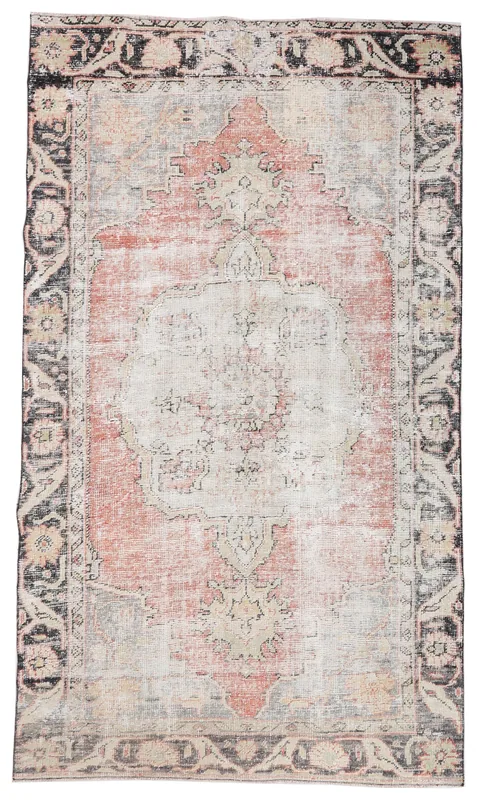 Full overhead view of the vintage Anatolian rug with a rose field and charcoal border.