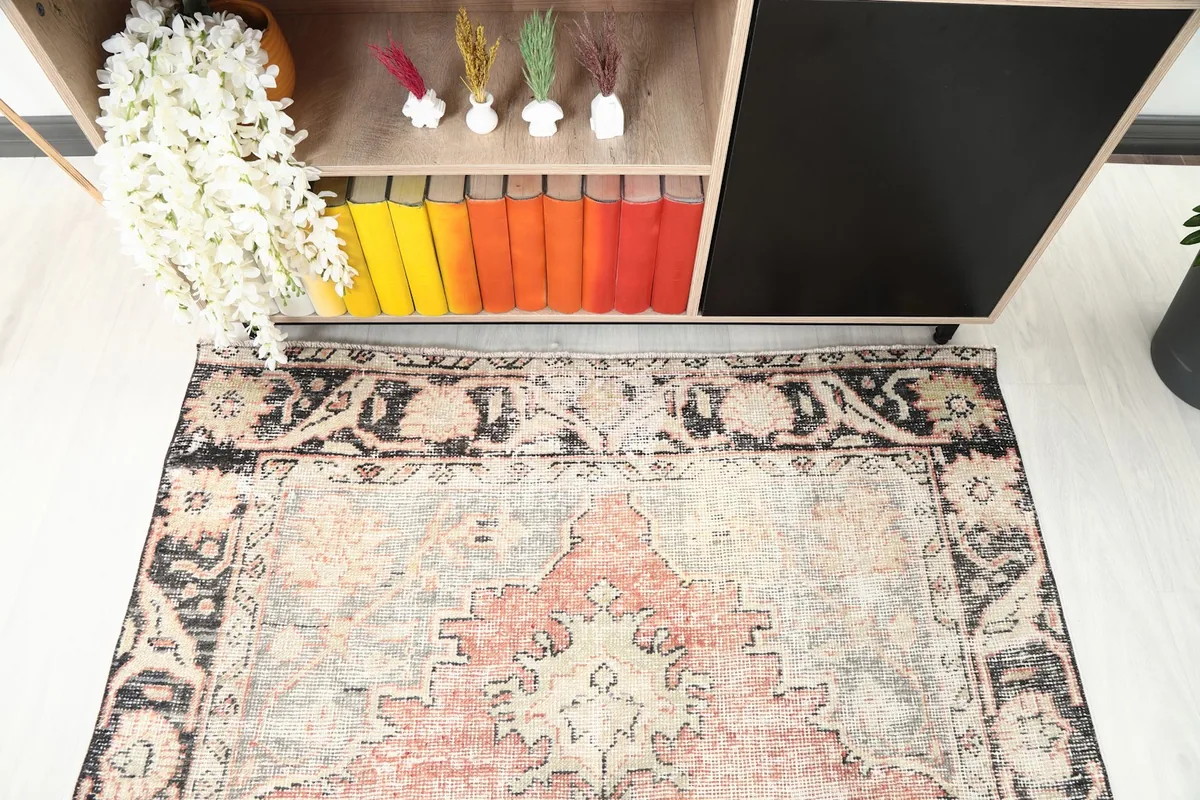 Partial overhead view of one end of the rug, detailing the border and field pattern.