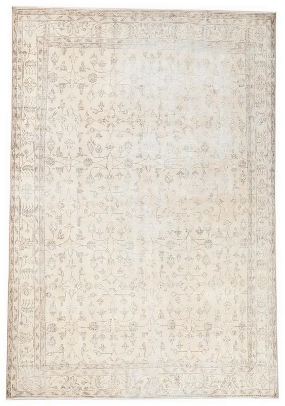 Full overhead view of the ivory and gray floral Anatolian rug on a white background