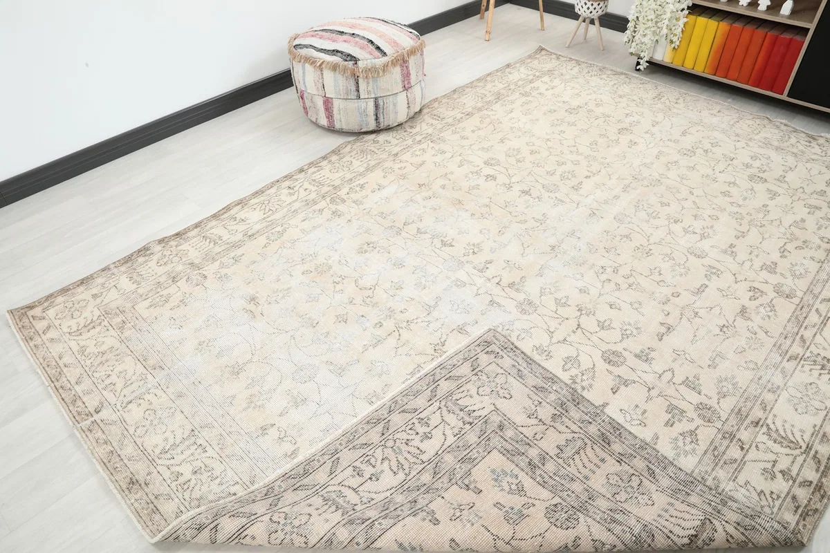 Overhead view of the rug with one corner folded back, showing the cotton foundation
