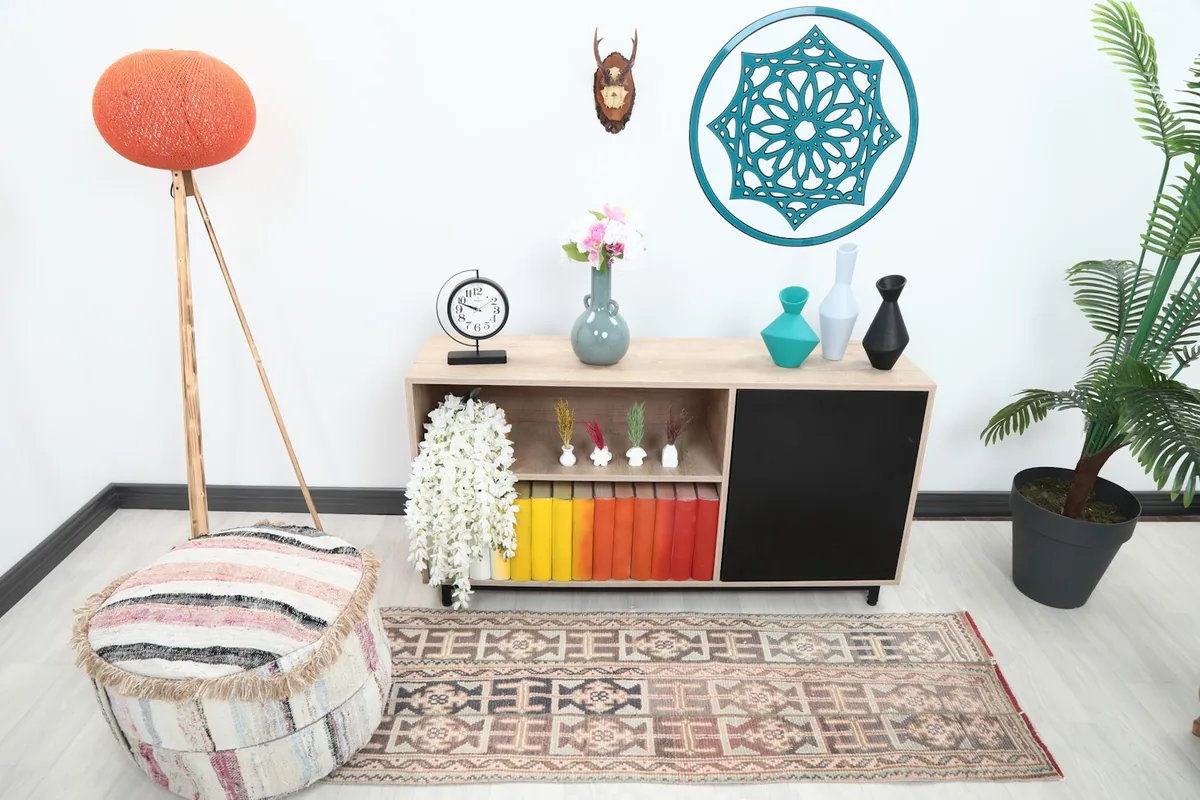 Runner rug placed in a modern living space with light colored furniture and decor