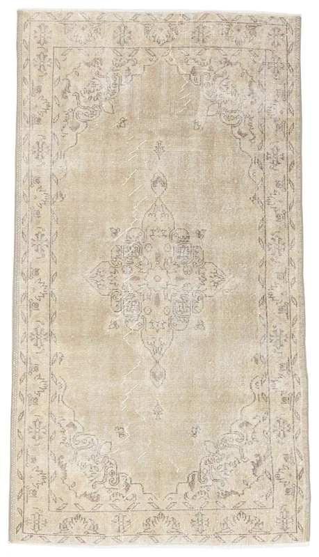 Full overhead view of the beige vintage Anatolian rug with a central medallion