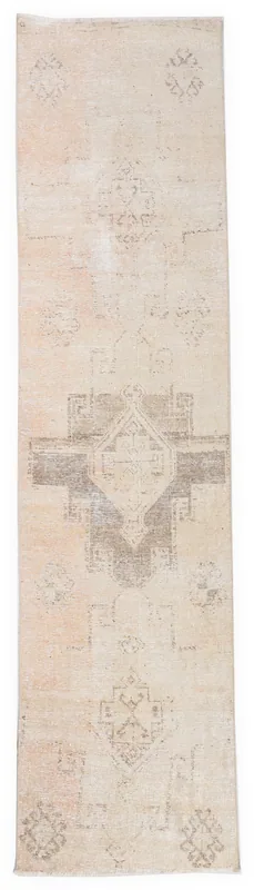 Full top view of the 2'9" x 11'0" beige geometric Anatolian runner on a white background