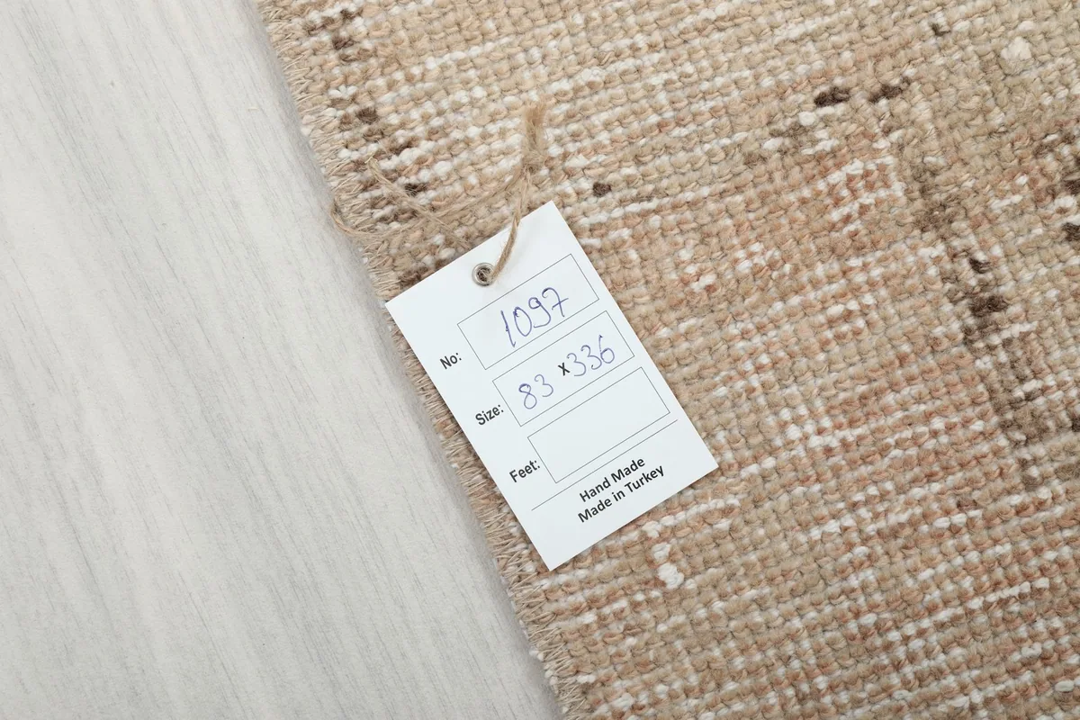 Close-up of the rug's corner with a tag indicating its size and origin from Turkey
