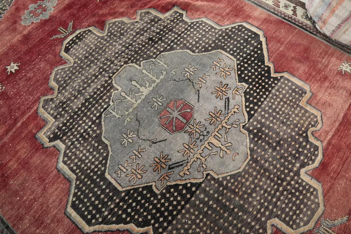 Close-up of the gray and black central medallion and surrounding geometric motifs