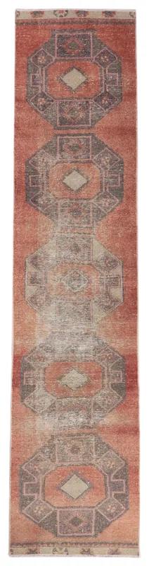 Full overhead view of the vintage Anatolian runner rug with rust field and charcoal geometric motifs.