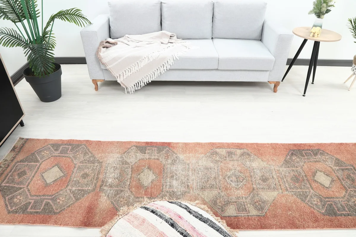 Overhead view of the runner rug in a room, highlighting its geometric design and colors in context.