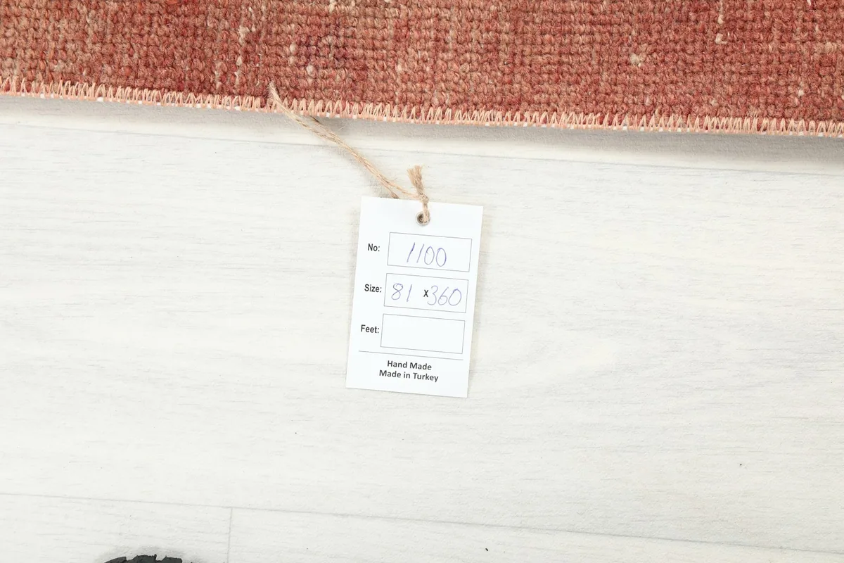 Product tag displaying the rug's size and origin, 'Hand Made in Turkey', on a white background.