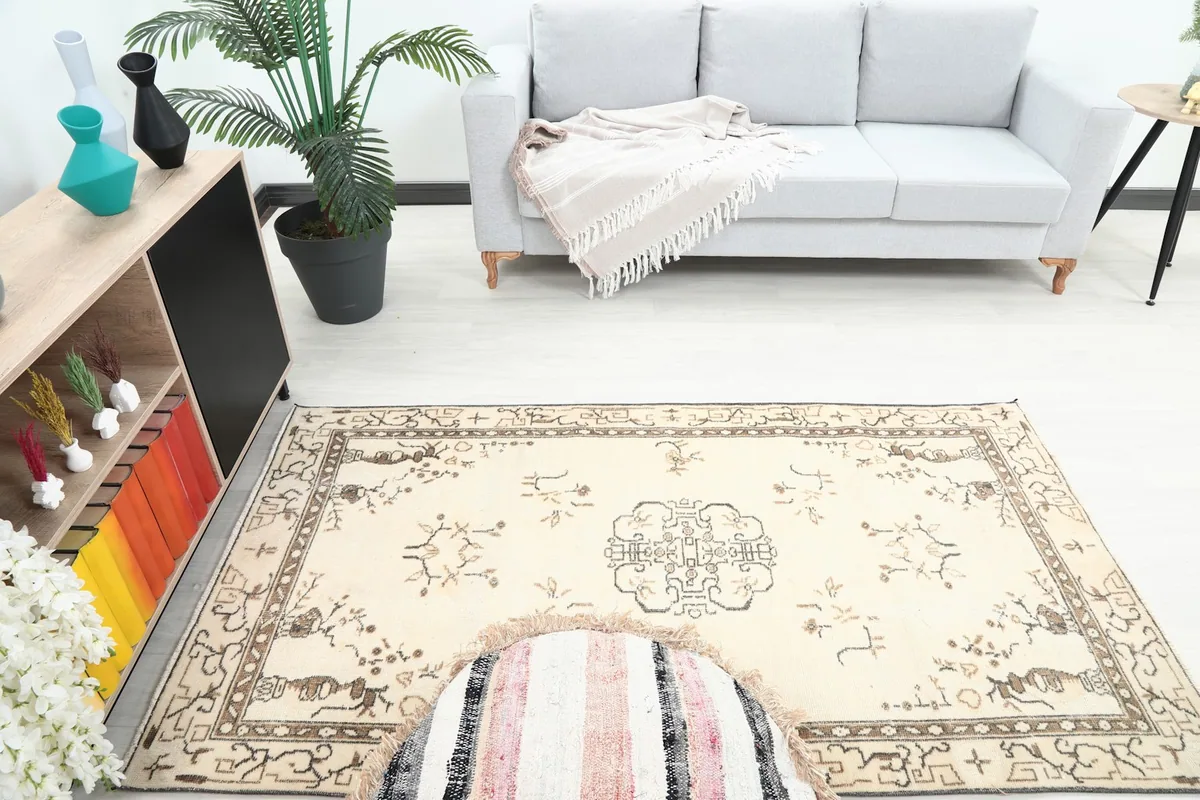 Overhead perspective of the small vintage rug in a living space, featuring its central medallion