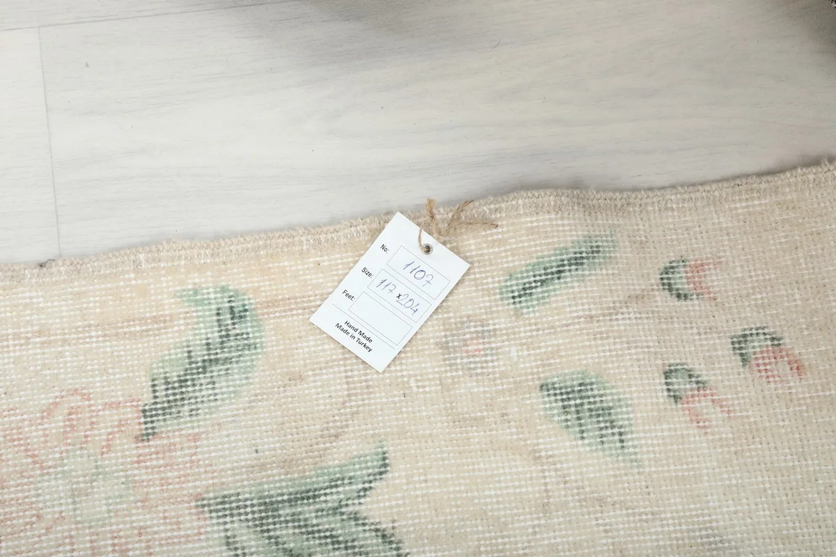 Photo showing the product tag with size and origin details on the rug