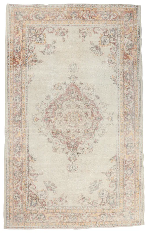 Full top view of the 6x10 ivory rug with rust and rose floral medallion