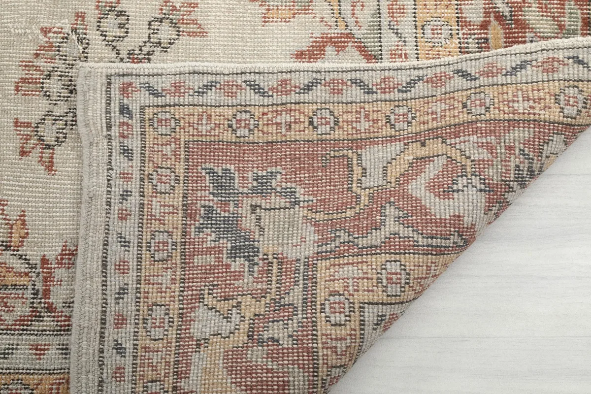 Reverse side of the rug, showing the intricate hand-knotted cotton foundation