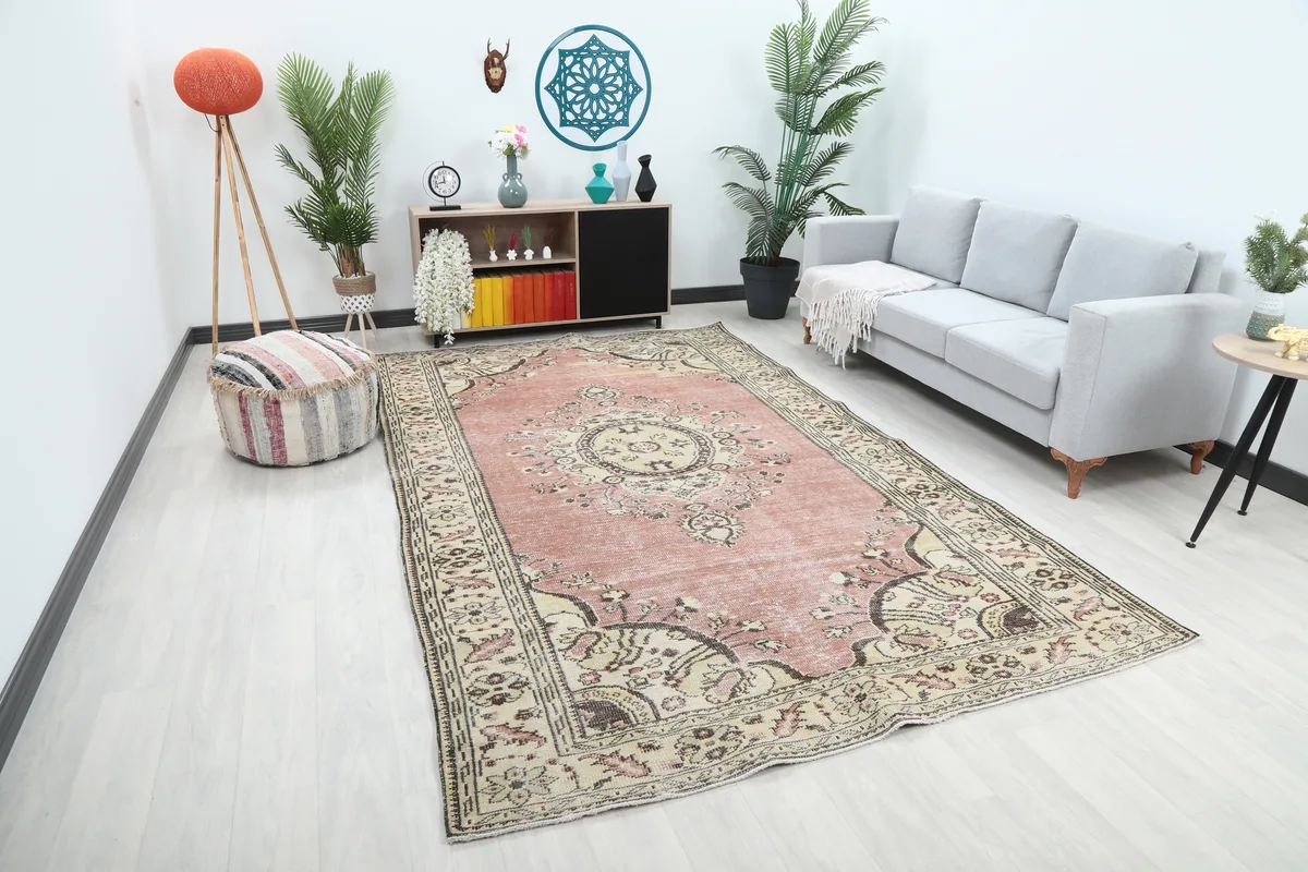 Wide view of the large rose area rug enhancing a modern living space