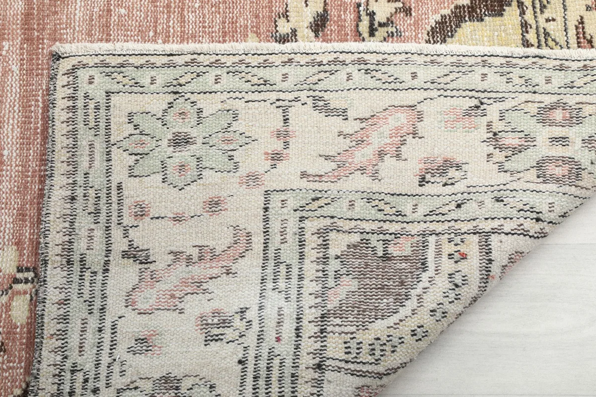 Close-up of the rug's reverse side, showing the intricate knotting and structure