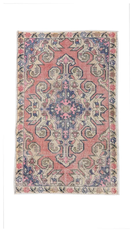 Full top view of the 4'4" x 6'10" vintage Anatolian rug with rose, navy, and beige geometric patterns.
