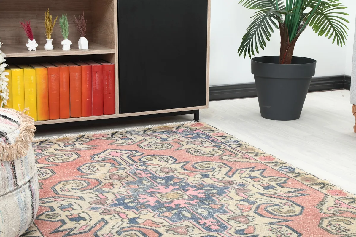 Close-up of the rug's pattern and colors, showing its integration into the room's decor.