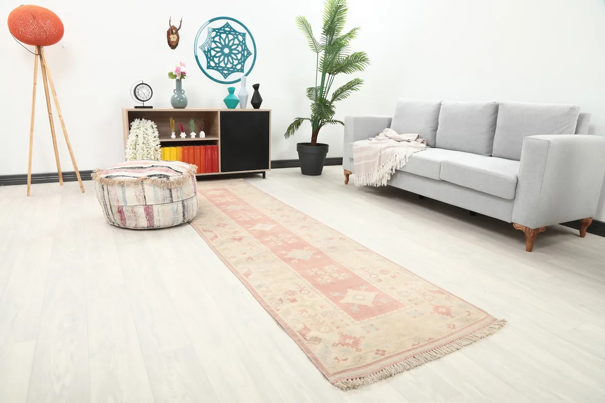 Angle view of the runner in a living room setting, showcasing its length and colors.